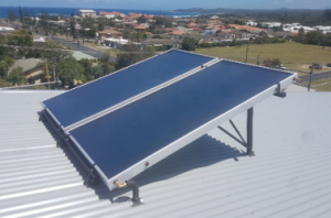 FPC Pitch on a rooftop with solar panels facing the sun